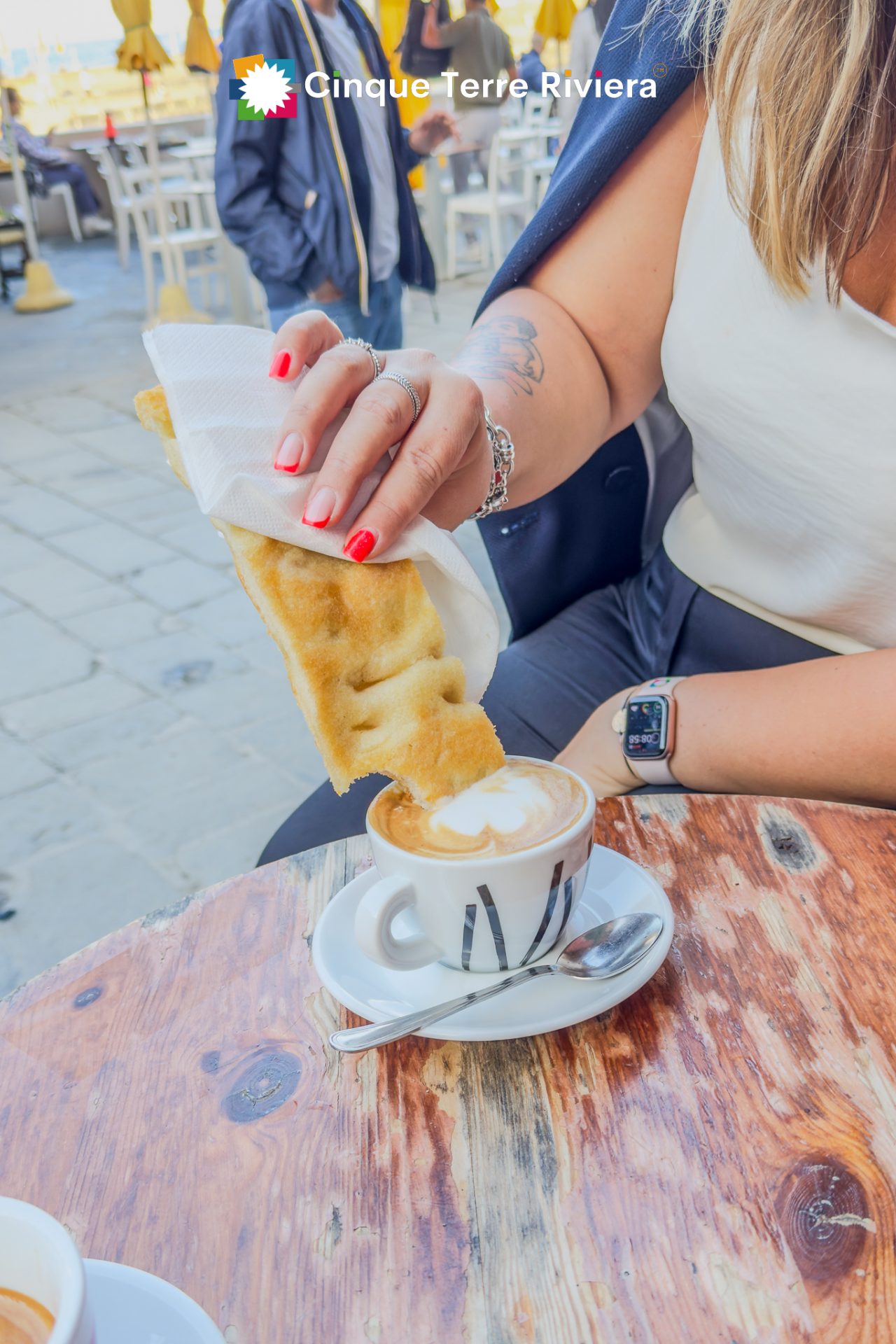 focaccia and cappuccino close up in the piazza of Vernazza