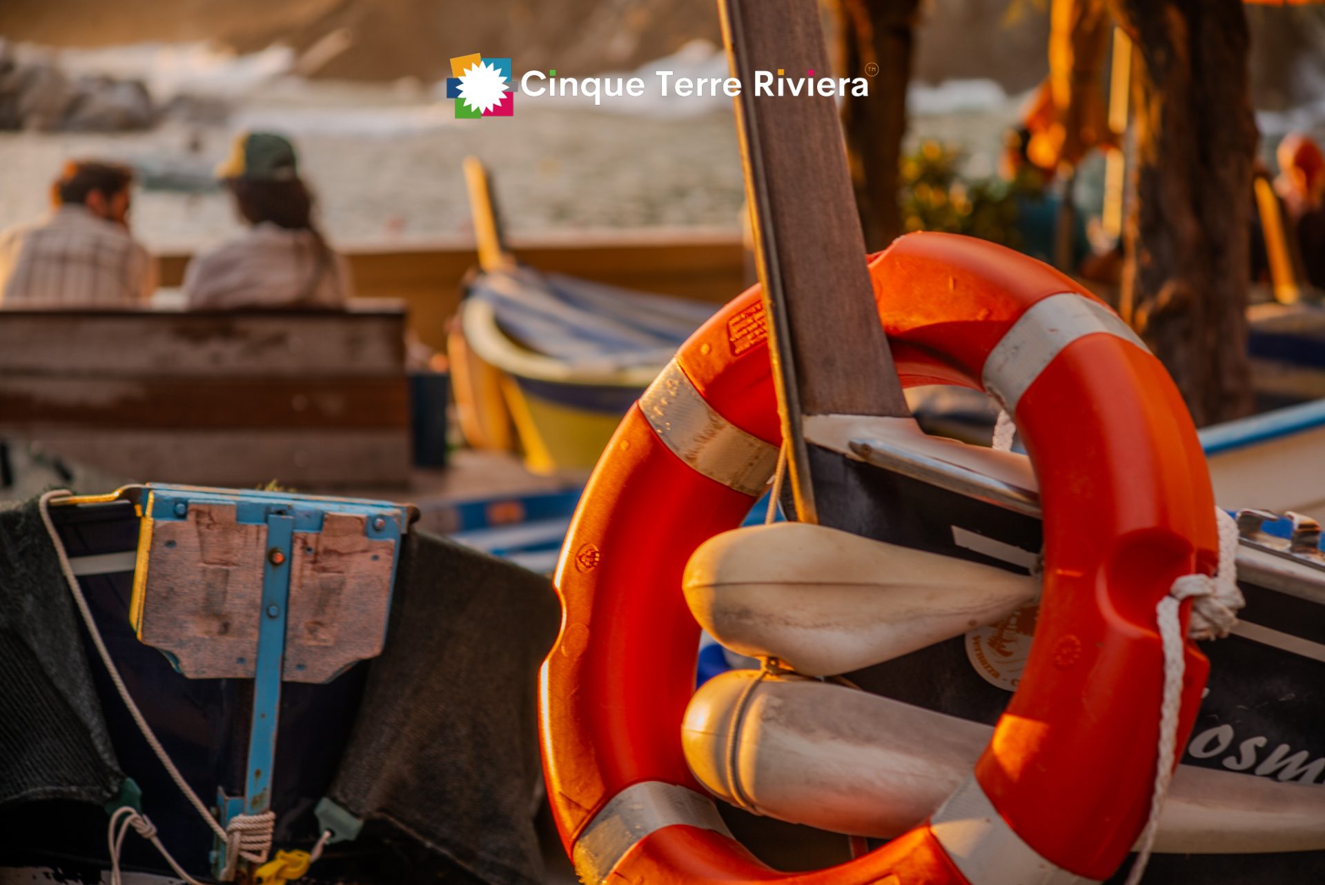 sunset light on Vernazza boats with a couple chatting